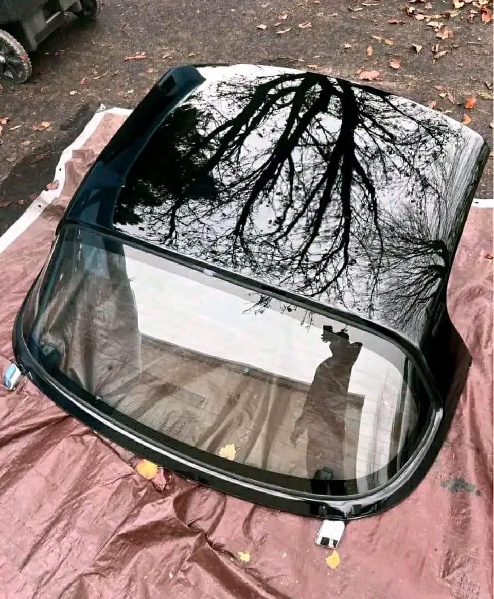 Oem black Miata hardtops.